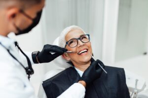 Dentist applying same day dental crown using advanced technology