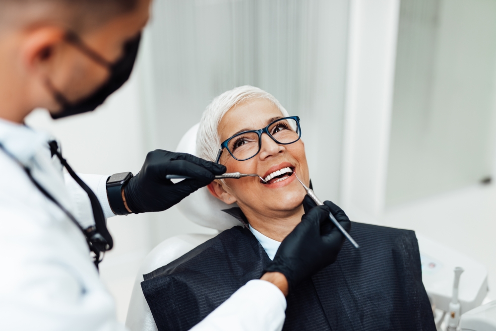 Dentist applying same day dental crown using advanced technology